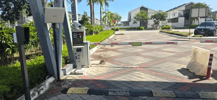 RFID gate system with barrier arm installed at a gated residential community entrance managed by Gprop Systems.